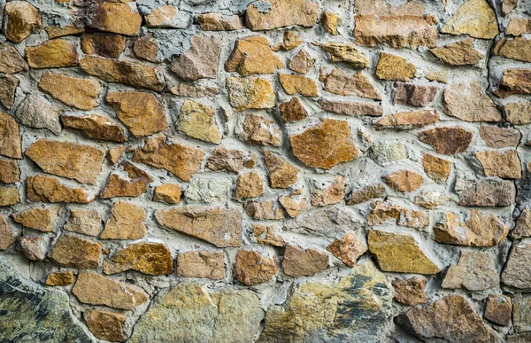 The texture of the old masonry. Background image of a stone-line — Stock Photo, Image