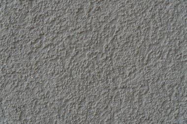 Kumaşlı boyayla kaplı bir duvarın arkaplan resmi. Duvar kağıdı. Metin için substrat. Dekoratif sıva deseni. İç ve dış duvarlar var. Üst görünüm.