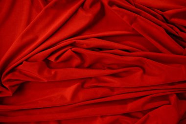 Buruşuk kumaşın arkaplan resmi. Kırmızı bez.