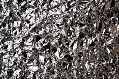 Buruşmuş alüminyum folyo dokusu. Arkaplan resmi. Metalik parlaklık