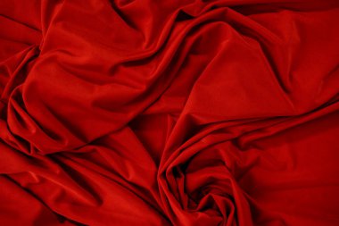 Buruşuk kumaşın arkaplan resmi. Kırmızı bez.