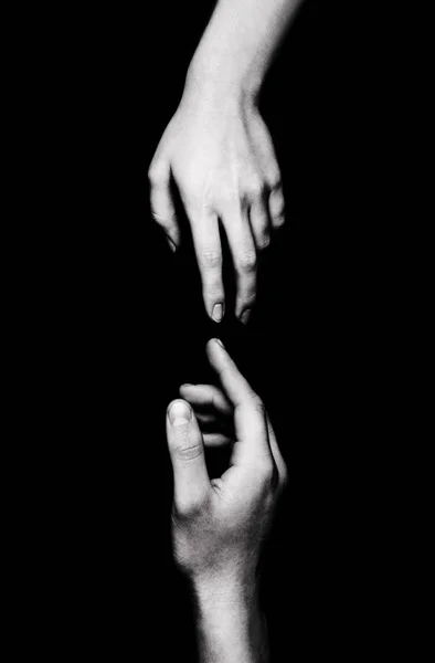 hands on black background