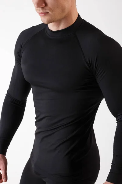 The guy in thermal underwear on a white background. Sportswear. — Stock Photo, Image