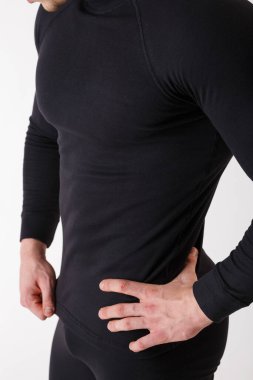 Beyaz arka planda termal iç çamaşırlı adam. Spor kıyafetleri..