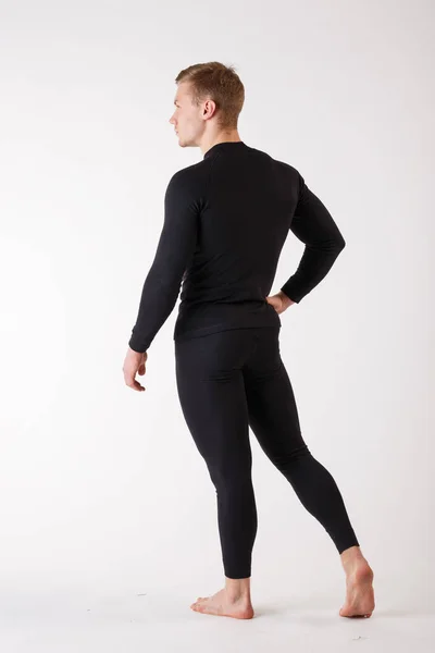 The guy in thermal underwear on a white background. Sportswear. — Stock Photo, Image