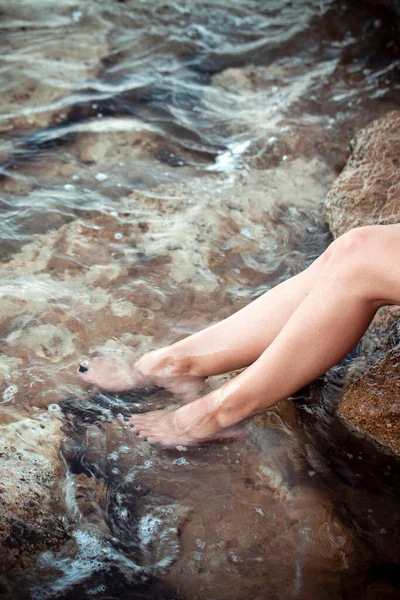 Young Woman Foot in the Clean Sea Water Photo