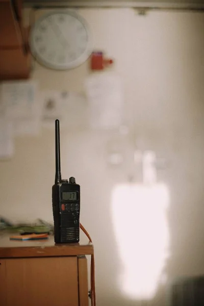 Marine VHF on the table in cabin. Copy space. Blur. Background