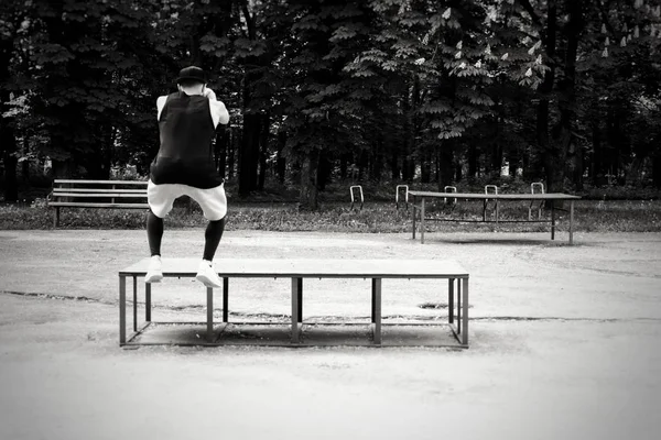 young and athletic  man on a day jog. Street training. Running in nature.Man in the street.