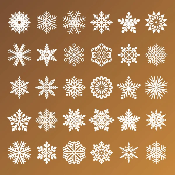 Sammlung goldener Vektor-Schneeflocken auf weißem Hintergrund — Stockvektor