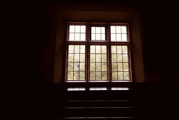 Darkened room showing view out of window - image — Stock Photo, Image