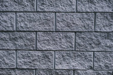 Gri şehir tuğla duvar. Koyu gri arka plan. Metin için alan kopyalama.
