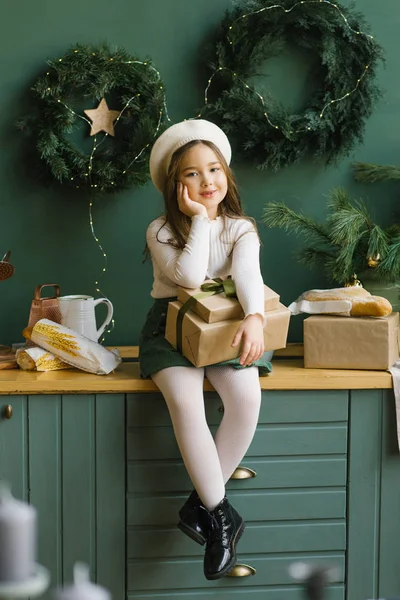 Stylishly Dressed Girl Holding Christmas Gift Sitting Kitchen Table Smiling — Stock Photo, Image