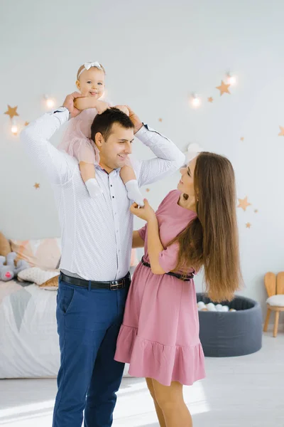 Daughter Smiles Rolls Her Father Neck Happy Mom Standing — Stock Photo, Image