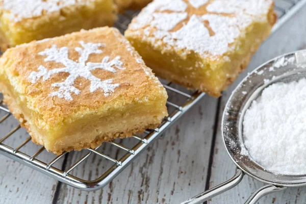 Lemon squares with powdered sugar.