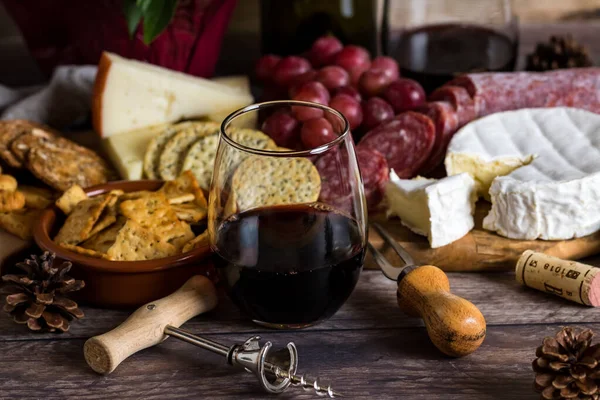 Stemless wine glass and cheese spread. — Stock Photo, Image
