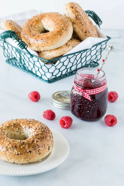 Everything Bagels with raspberry jam ready for eating. — Stock Photo, Image