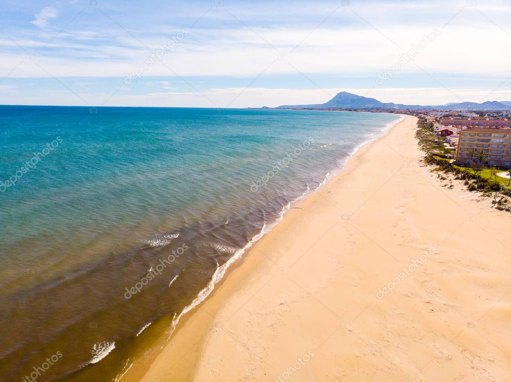 Aerial view of a desert beach in Denia, Spain, Montg�� mountain is in the background