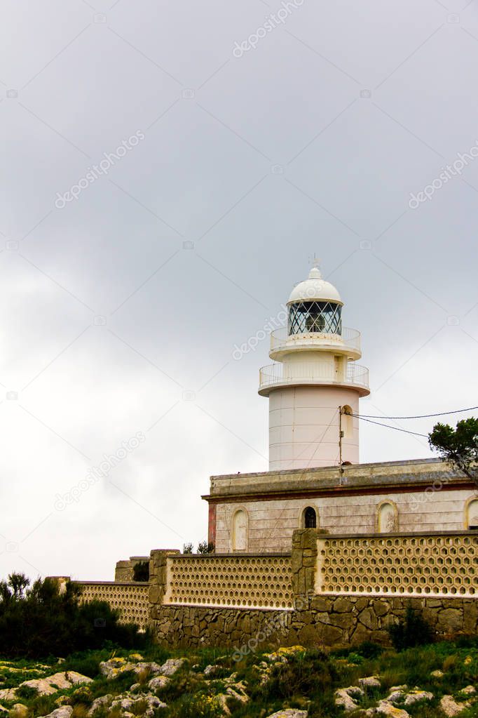 LIghthouse in the cape of San Antonio, in Javea, Spain, on a cloudy day
