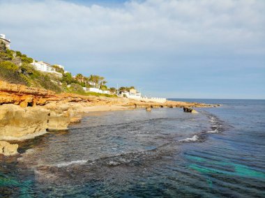Denia, İspanya, Las Rotas kayalık plaj gün batımında havadan görünümü