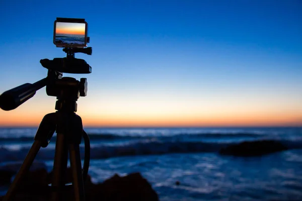 Action camera capturing a sunrise on \
