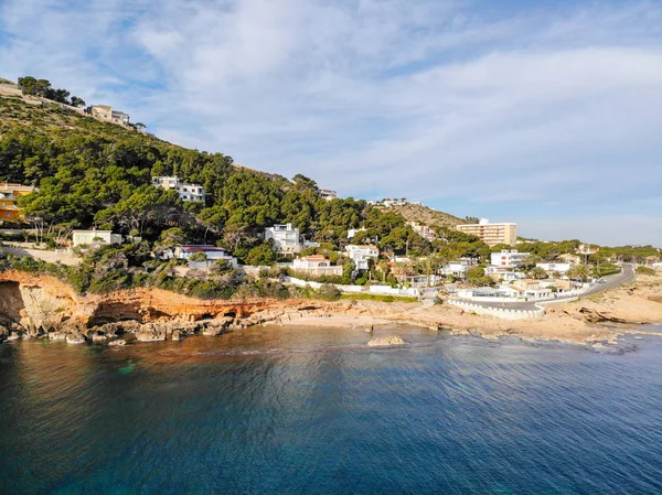 Vista aérea de la playa rocosa de Las Rotas en Denia, España al atardecer — Foto de Stock