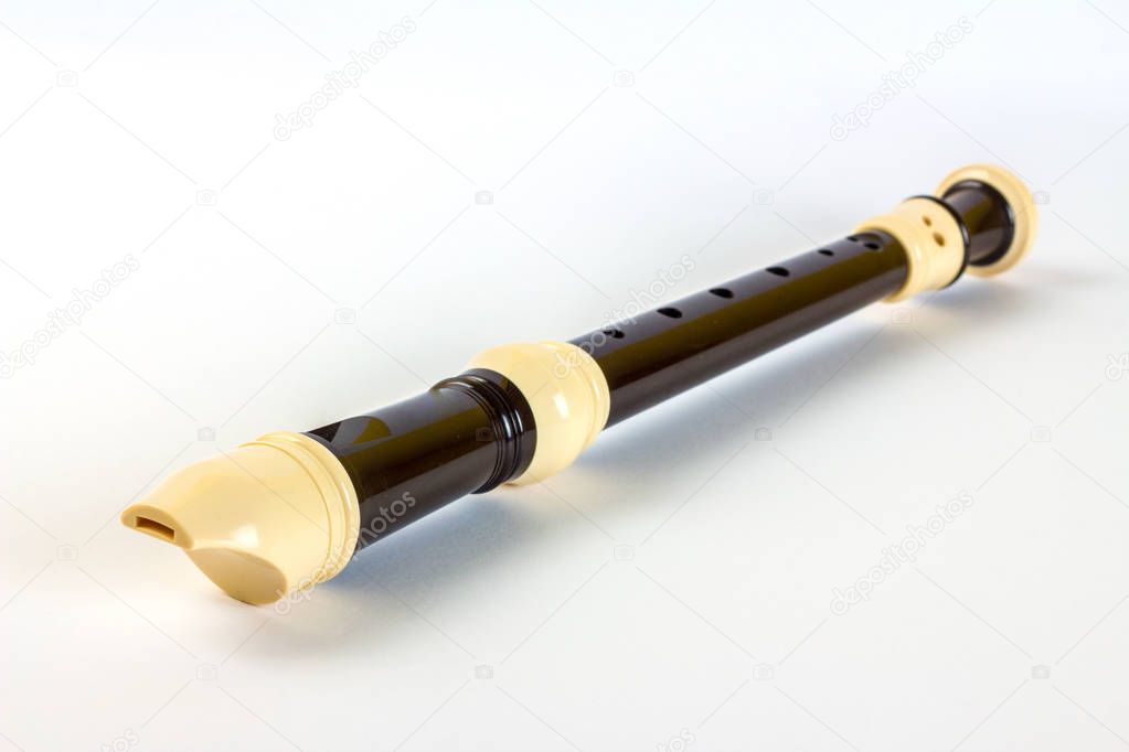 Plastic soprano recorder flute, isolated on white background