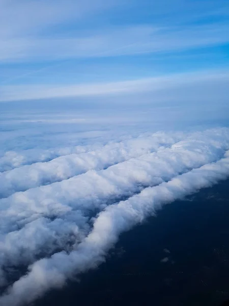 White clouds above the ground