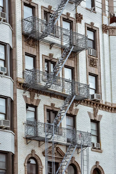 Facades of apartments, with fire stairs. Soho, Manhattan. NYC