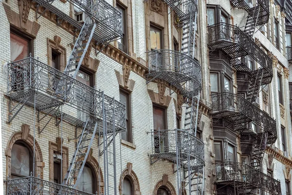 Old apartment facades, with fire stairs. Soho, Manhattan. NYC