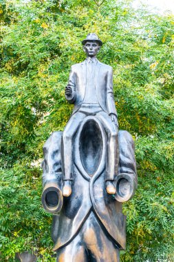 PRAGUE, CZECH REPUBLIC - OCTOBER 17, 2018: Franz Kafka Memorial. Unusual sculpture in Jewish Quarter, Prague, Czech Republic. clipart