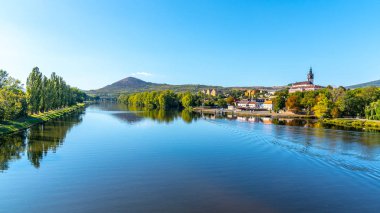 Radobyl Mountain in Ceske Stredohori, Central Bohemian Uplands. View from Labe River in Litomerice, Czech Republic clipart