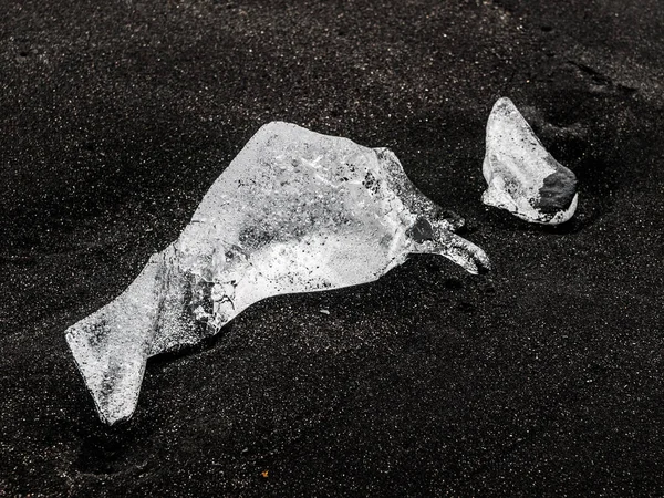 Piece of ice on black sand, natural detail, Iceland — Stock Photo, Image