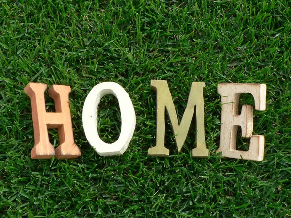 Inscription Home Wooden Letters Green Grass Background — Stock Photo, Image