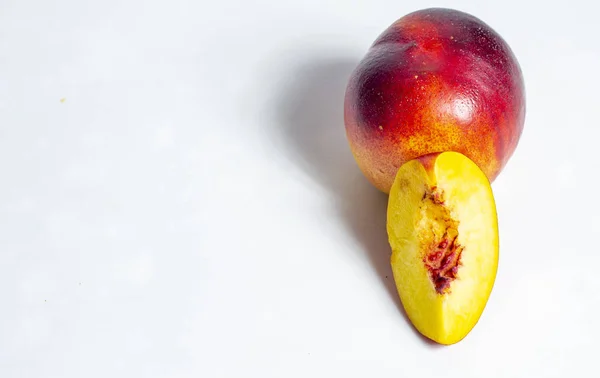 ripe peaches on a white background