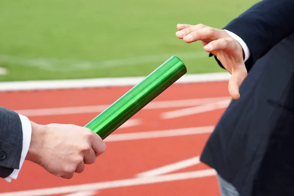 Businessman Taking Green Baton Relay Race — Stock Photo, Image