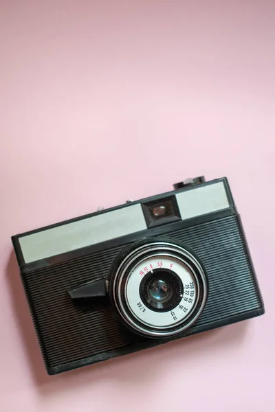 Film retro camera on a pink background 3