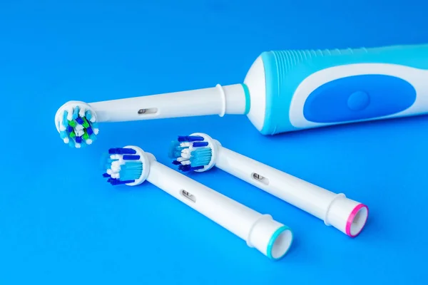 Electric Toothbrush on blue background — Stock Photo, Image