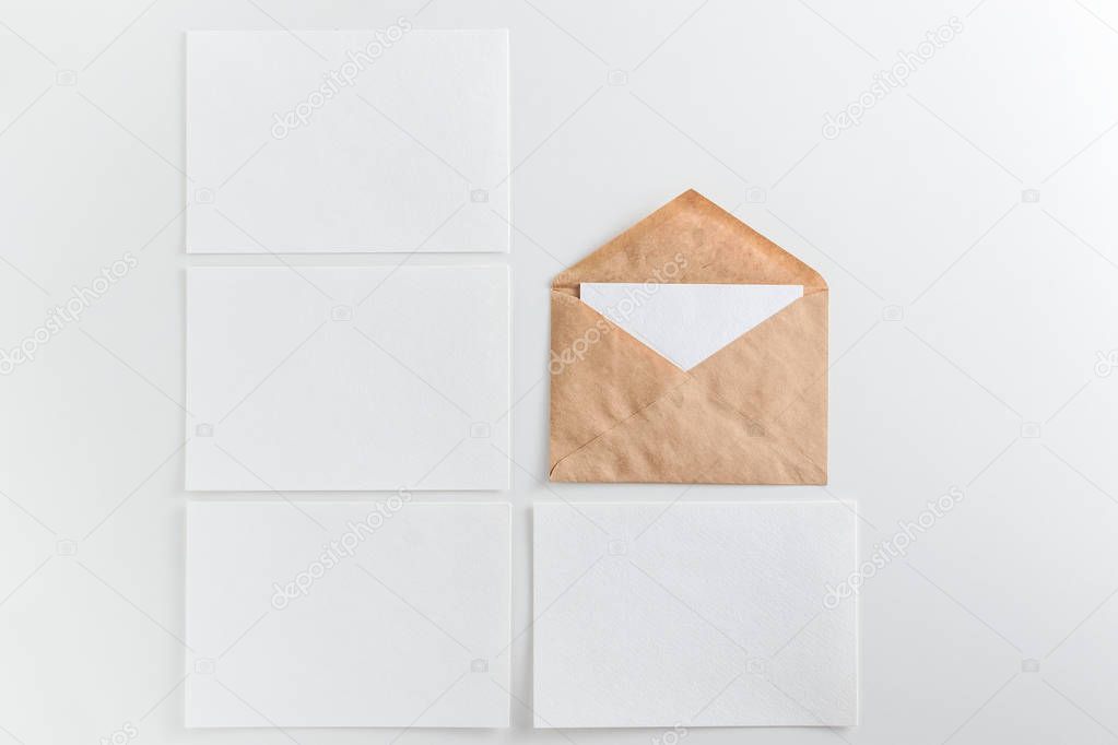 Blank white cards and envelope on white background