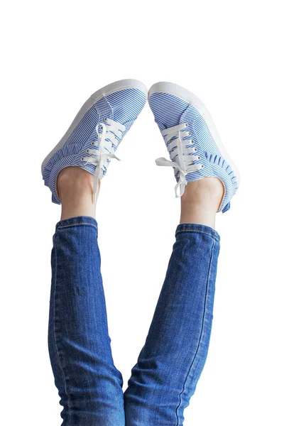 Woman legs in a blue jeans on white background isolated — Stock Photo, Image