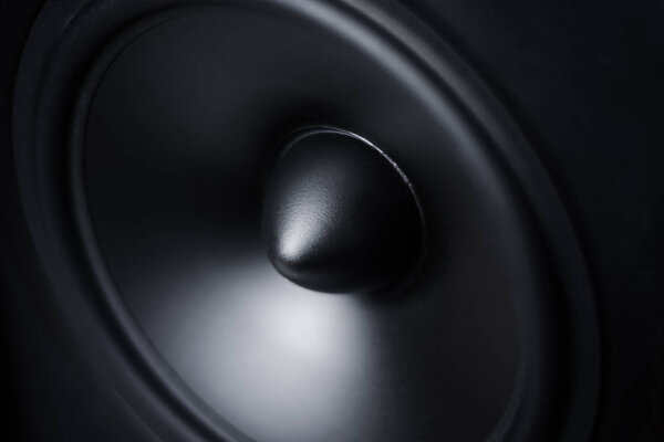 Close up of membrane sound speaker on black background