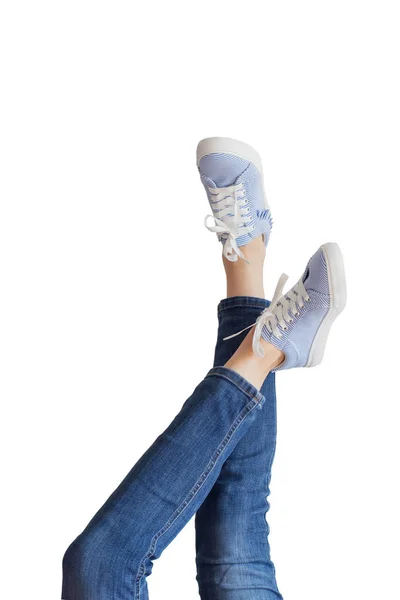 Woman legs in a blue jeans on white background isolated — Stock Photo, Image