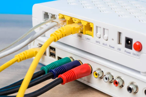 Modern internet router with connecting cables, closeup — Stock Photo, Image