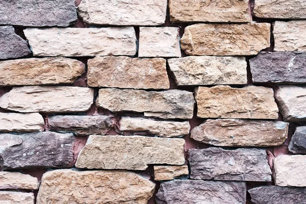 古い壁の石の質感。レンガを持つ抽象的な背景 — ストック写真