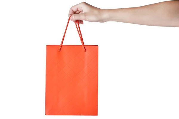 女人手拿着红色空白工艺纸购物袋隔离 — 图库照片