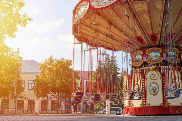 Chain carousel merry-go-round at amusement park