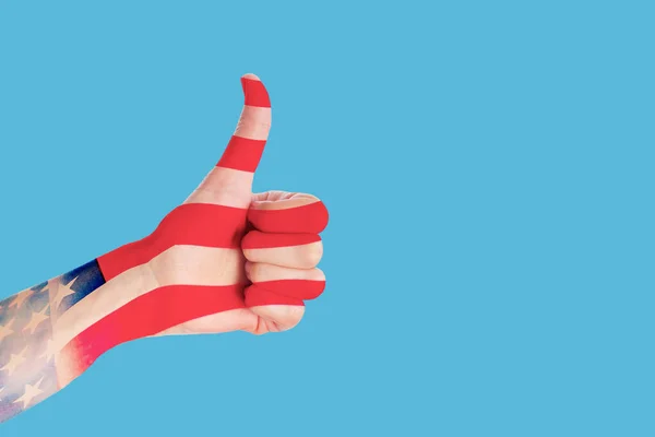 USA president election day concept. Thumb up gesture in american flag colors on blue background