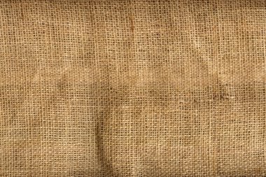 Kaba bir çuval bezinin detaylı bir görüntüsü. İplik ve lif kumaş yakın plan. Tam kare. Çoklu görev geçmişi. Yukarıdan görüntüle.