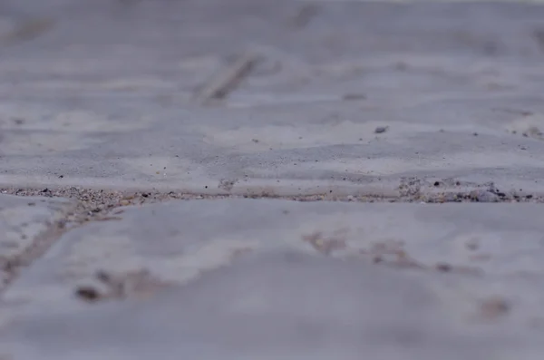 歩道上の灰色の石のテクスチャの完全なフレーム 灰色の石畳の舗装を閉じます 抽象的な背景 選択的焦点 — ストック写真