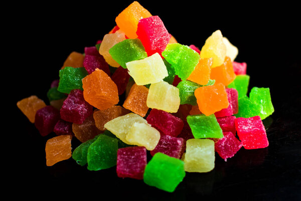 Candied fruits on a black background