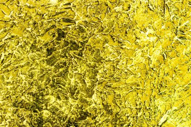 Duvardaki alçının dokusu altın la boyanmıştır. Arka plan.